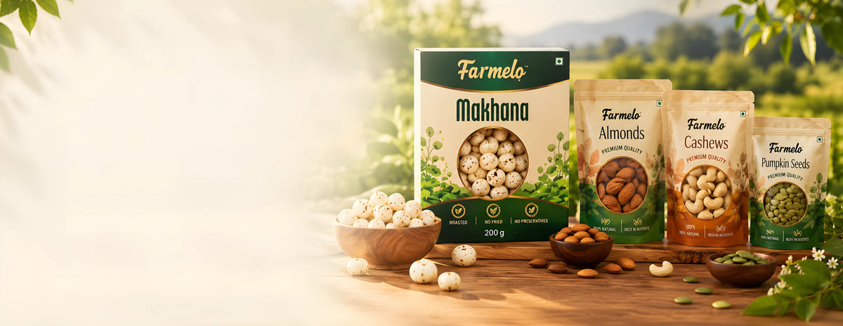 Farmelo makhana box with almond, cashew and pumpkin seed pouches on a wooden table in a sunlit field